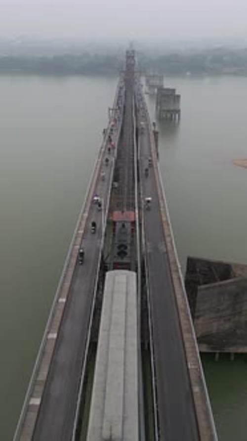Aerial of the Historic Long Bien Bridge with Train on Railway in Hanoi Vietnam