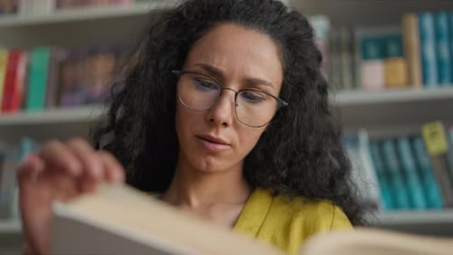 Latin Hispanic Arab Woman Girl Reading Book Turning Pages Library Literature Bookworm Student