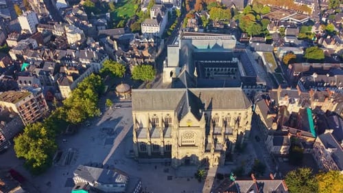 Drone Orbiting Sainte-Anne Church and Jacobins Convent at Sunrise in Rennes - Brittany