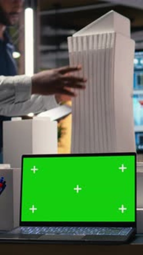 Vertical Video Developers Team Review Zoning Regulations for City Planning Next to Mockup