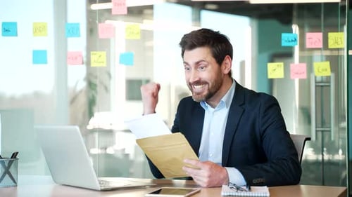 Excited Businessman Receives Good News at the Office