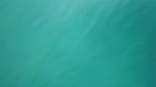 Flying Over Tropical Sea Water Surface Top View
