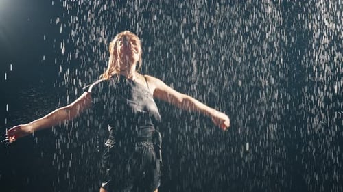 Blonde Woman Dancer Dancing Under Rain Beautiful Sensual Installation Performance of Girl in Wet