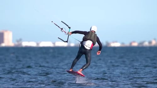 Sporstman practicce hydro foil kite surf boarding in Spain coast