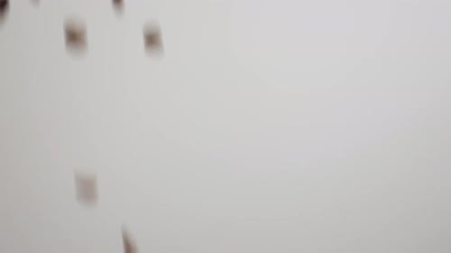 Abstract Rectangular Shapes Falling Against Gray Background