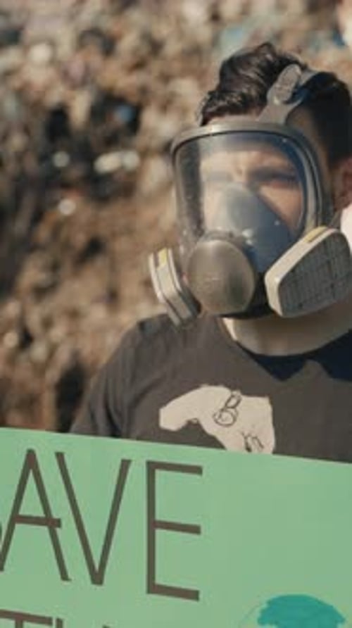 Young Adult Protesting Pollution Wearing a Gas Mask