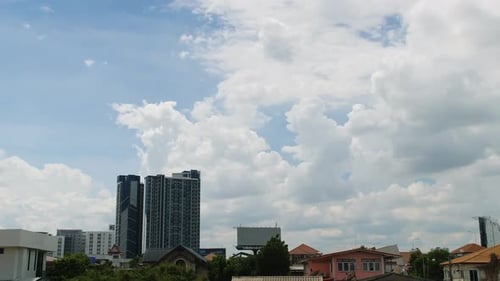 Clouds Pass Over Modern City Skyline, Timelapse
