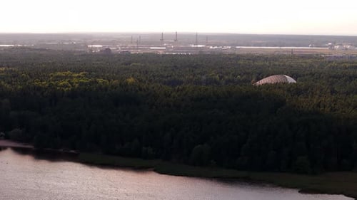 Drone landscape, waterfront forested countryside over river in Latvia, skyline background