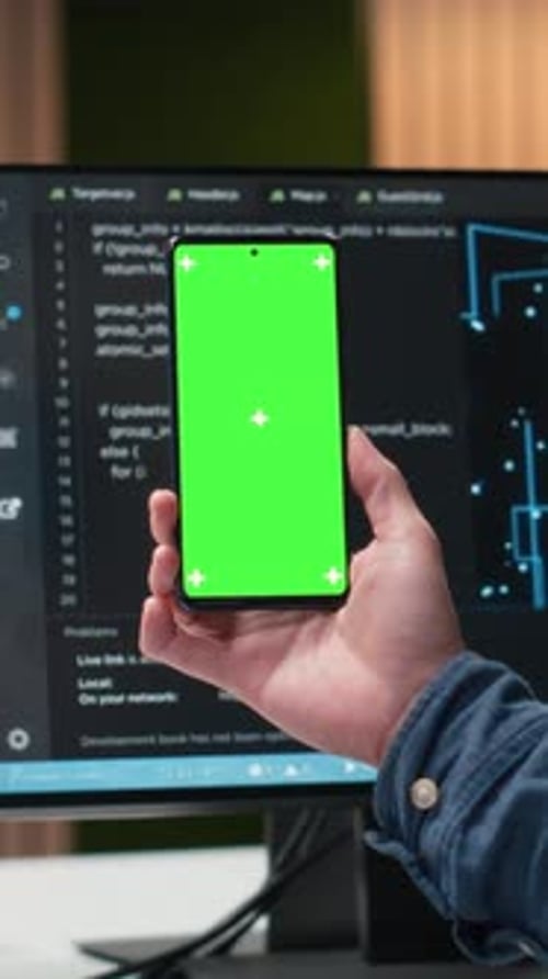 Vertical Video Green Screen Smartphone Used By Programmer in Tech Startup Office