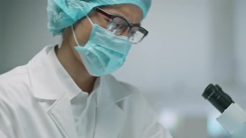 Scientist Examining a Test Tube in Lab