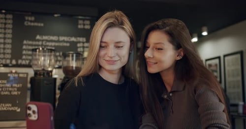 Young Women Taking Selfie in Restaurant