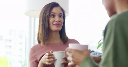 Two Friends Chatting, Relaxing Together Indoors