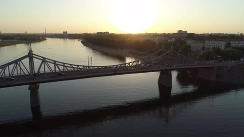 Aerial View of the Road Bridge Across the River at Sunset Beautiful Cityscape