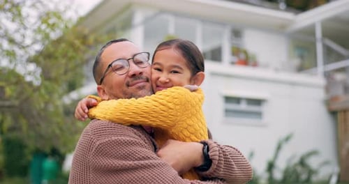 Father and Daughter Share Loving Embrace at Home