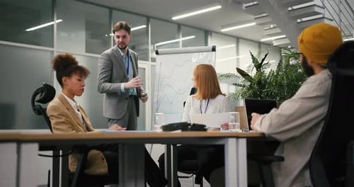 Presentation With Graph and Team in Modern Office