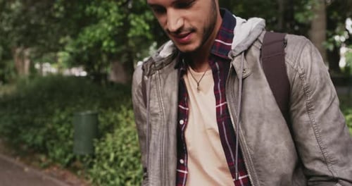 4k video footage of a young handsome man commuting in the city