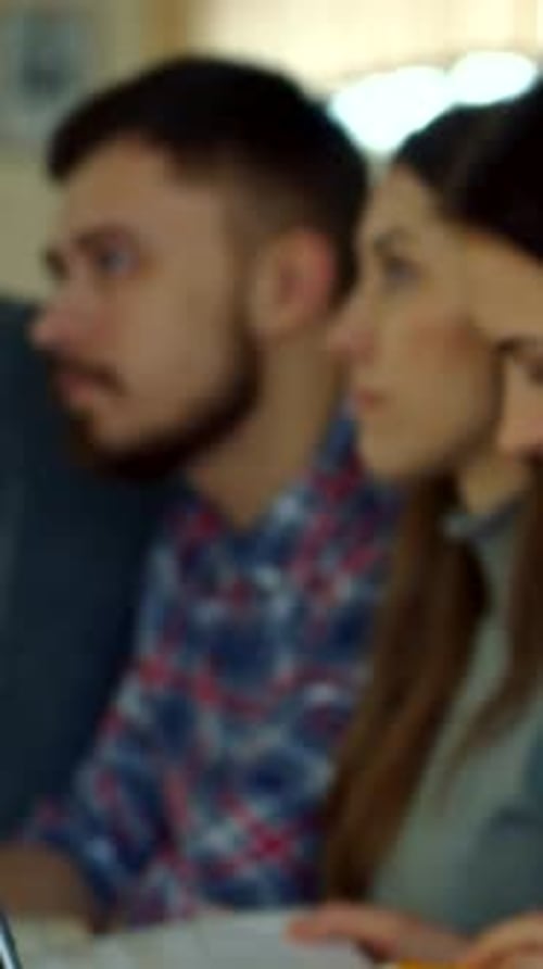 Engaging Female Student Focuses Intently During a Lecture