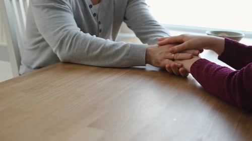 Couple Holding Hands at Home Happy Man and Woman Two Loving Hands Together on the Couch Sharing Deep