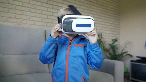 Boy Exploring Virtual Reality with VR Headset Indoors