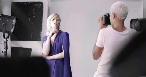 Fashion Model Posing for Photographer in Studio