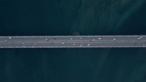 Aerial View of River and Cars Driving on Road Outdoors on Summer Day Irrl