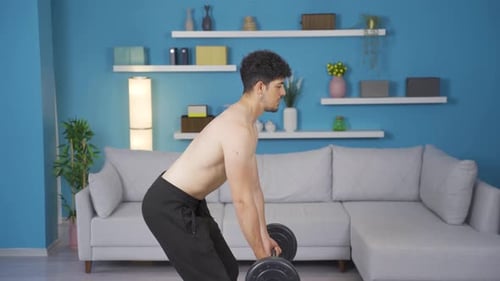 Man Weightlifting in a Living Room