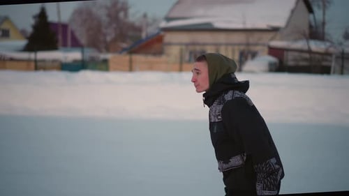 Side View Skater Gliding Gracefully on Ice with Blurred Buildings Background