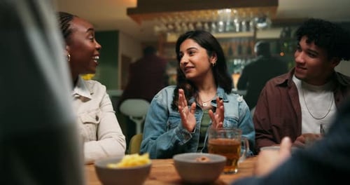 Laugh, smile and friends talk in pub for relax, social gathering or communication