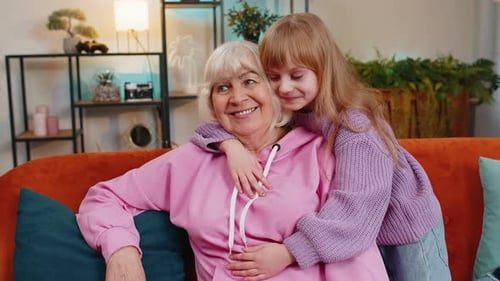 Granddaughter Hugging Grandmother in Cozy Home Setting
