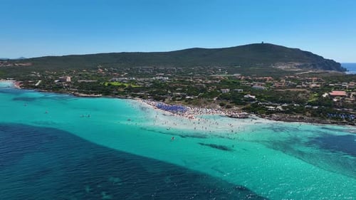 Aerial view on beach, people and umbrellas. Vacation and adventure. Europe, Mediterranean Sea.