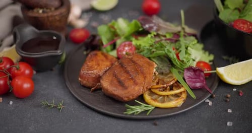 Grilled Veggie Patties with Garden Salad and Lemons