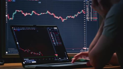Businessman Hands Working on Laptop or Computer Keyboard for Trading or Stock Market Investing Male