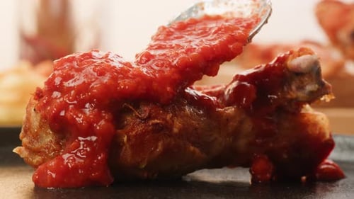 Pouring Grill Bbq Piece of Chicken Kebab Over Red Tomato or Ketchup Sauce Closeup Eat Chicken Crispy