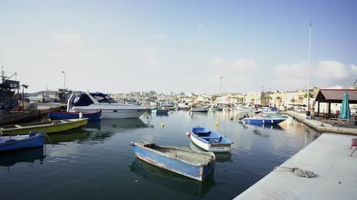 Overflooded fishing boats fleet docked at Marsaxlokk Malta