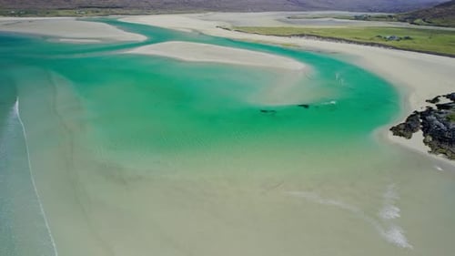 Aerial view of shawbost beach with waves and sand dunes, seilebost, scotland.