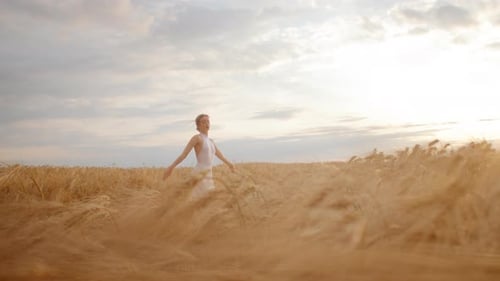 Adorable Cfemale in White Dress Standing in Middle of Field