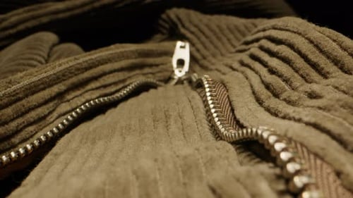 Close-Up of a Brown Corduroy Garment with Zipper