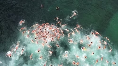 Aerial view of people swimming in ocean waves, Bulgaria.