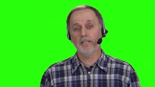 Man in Headset on Green Screen Speaking
