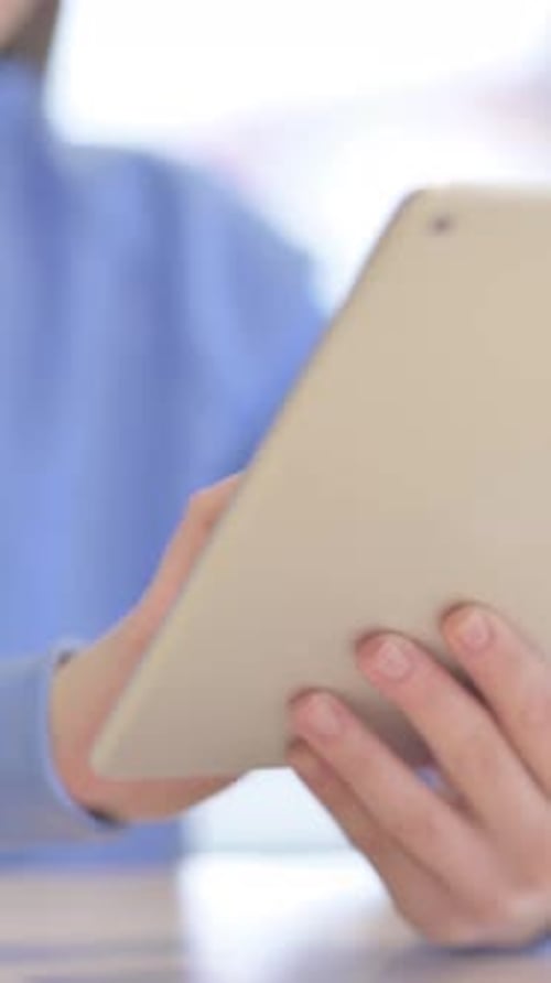 Close up of Woman using Tablet, Browsing Internet, Vertical Video
