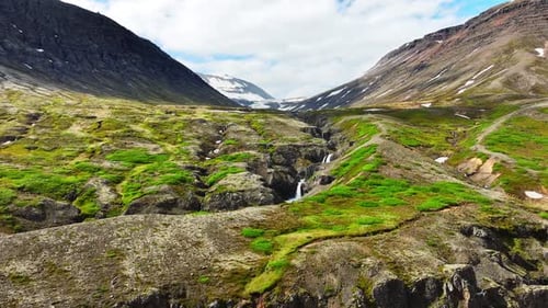 Waterfall in the Mountains Clear Glacial River Flows in the Canyon Iceland Summer Nature Clear Sunny