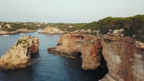 Aerial View of Coastal Cliffs with Turquoise Water