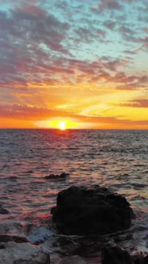 Sea and Rocks During Beautiful Sunset