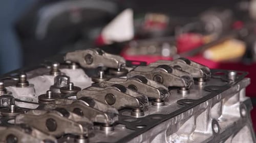 Mechanic Covers Valve Of Car Engine In Repair Shop 3
