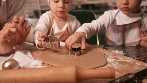 Children Baking Christmas Cookies at Home