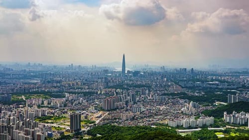 Timelapse of Clouds Over Seoul Cityscape with Lotte World Tower