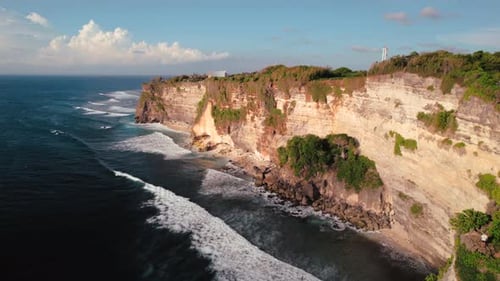 Rocky Cliff Coastline and Ocean Sea Near Uluwatu Temple in Bali Indonesia