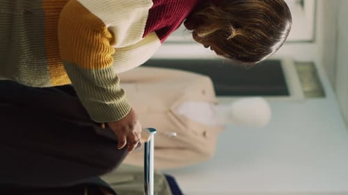 Employees Sorting Clothing at Retail Workplace Indoors