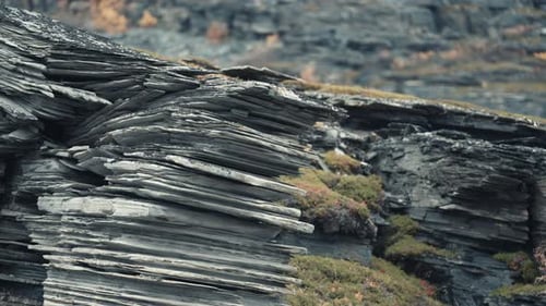 A close-up of the layers of stone. Peculiar geological formation. Slow-motion.