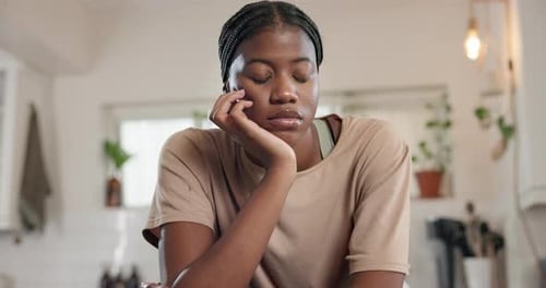 Bored, black woman and thinking in home, lonely or student with disappointment